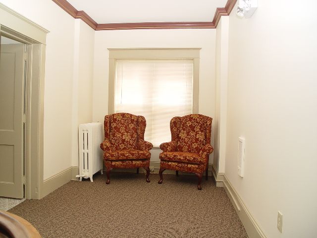 A furnished sitting room with two armchairs